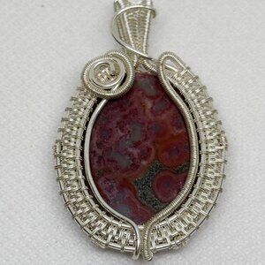Silver plated wire wrap pendant featuring red Moss Agate gemstone, NWOT